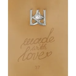 Hvide læderpumps med glitrende blomst