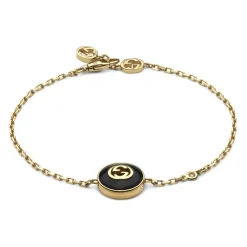 Interlocking armbånd i gult guld, onyx og diamant