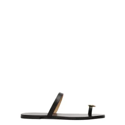 Minimalistiske sorte mules på en flad sål